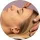 A picture of a man receiving facial reflexology.